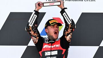 First-placed Fantic Racing Spanish rider Aron Canet (C) celebrate on the podium after competing in the Indonesian Grand Prix Moto2 race at the Mandalika International Circuit in West Nusa Tenggara on September 29, 2024. (Photo by SONNY TUMBELAKA / AFP)
