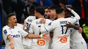 Marseille's players celebrate after scoring a goal during the French L1 football match between Olympique de Marseille (OM) and Stasbourg (RC Stasbourg) at the Velodrome stadium in Marseille, southern France on March 12, 2023. (Photo by CHRISTOPHE SIMON / AFP)