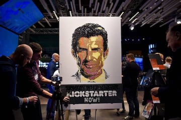 Entrepreneurs of the Kickstarter crowdfunding platform make a demonstration with a picture of football player Luis Figo during the Web Summit at Parque das Nacoes in Lisbon