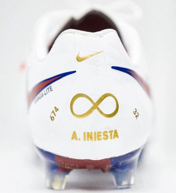 Iniesta signs off in special boots