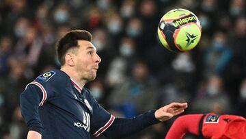 Paris Saint-Germain's Argentinian forward Lionel Messi eyes the ball during the French L1 football match between Paris-Saint Germain (PSG) and OGC Nice at The Parc des Princes Stadium in Paris on December 1, 2021. (Photo by Anne-Christine POUJOULAT /