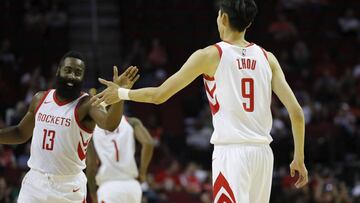 HOUSTON, TX - OCTOBER 05: James Harden #13 of Houston Rockets congratulates Zhou Qi #9 after scoring in the second quarter against the Shanghai Sharks at Toyota Center on October 5, 2017 in Houston, Texas. NOTE TO USER: User expressly acknowledges and agrees that, by downloading and or using this Photograph, user is consenting to the terms and conditions of the Getty Images License Agreement. Tim Warner/Getty Images/AFP
== FOR NEWSPAPERS, INTERNET, TELCOS & TELEVISION USE ONLY ==