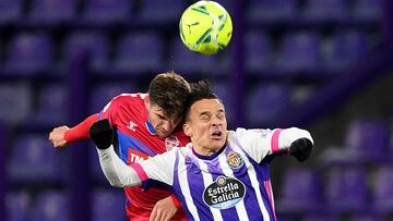 VALLADOLID, SPAIN - JANUARY 19: Raul Guti of Elche CF challenges for the high ball with Roque Mesa of Real Valladolid  during the La Liga Santander match between Real Valladolid CF and Elche CF at Estadio Municipal Jose Zorrilla on January 19, 2021 in Val