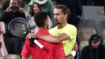 Winner Serbia's Novak Djokovic (L) cheers Germany's Alexander Zverev at the end of their men's singles quarter-final match on day 11 of the French Open tennis tournament on Court Philippe-Chatrier at the Roland-Garros Complex in Paris on June 4, 2025. (Photo by Thibaud MORITZ / AFP)
