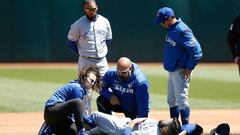 OAKLAND, CA - APRIL 20: Starting pitcher Matt Shoemaker #34 of the Toronto Blue Jays receives treatment on his leg after a collision while getting the out of Matt Chapman #26 of the Oakland Athletics in the bottom of the third inning at Oakland-Alameda County Coliseum on April 20, 2019 in Oakland, California.   Lachlan Cunningham/Getty Images/AFP
 == FOR NEWSPAPERS, INTERNET, TELCOS &amp; TELEVISION USE ONLY ==