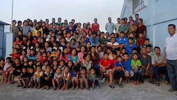 FILE PHOTO: ATTN EDITORS: IMAGE 17 OF 51 OF PICTURE PACKAGE &#039;7 BILLION, 7 STORIES - THE WORLD&#039;S LARGEST FAMILY&#039;. SEARCH &#039;BAKTAWNG&#039; TO SEE ALL IMAGES  Family members of Ziona (R) poses for group photograph outside their residence i