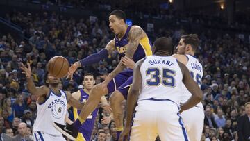 December 22, 2017; Oakland, CA, USA; Los Angeles Lakers forward Kyle Kuzma (0) passes the basketball against the Golden State Warriors during the fourth quarter at Oracle Arena. The Warriors defeated the Lakers 113-106. Mandatory Credit: Kyle Terada-USA TODAY Sports
