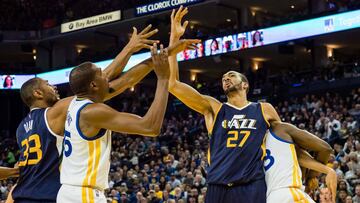 Apr 10, 2017; Oakland, CA, USA; Utah Jazz center Rudy Gobert (27) holds back Golden State Warriors forward Draymond Green (23) as b battle for the ball against Golden State Warriors forward Kevin Durant (35) with Utah Jazz center Boris Diaw (33) during the third quarter at Oracle Arena. The Jazz won 105-99. Mandatory Credit: Kelley L Cox-USA TODAY Sports