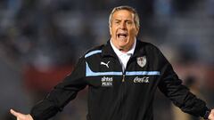 (FILES) In this file photo taken on September 11, 2012 Uruguay&#039;s coach Washington Tabarez gestures during a Brazil 2014 World Cup South American qualifier match against Ecuador at the Estadio Centenario in Montevideo. - Oscar Tabarez was dismissed on