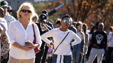 People stand in line for early voting in midterm elections at a public library and voting station in the Buckhead area of Atlanta, Georgia, U.S., November 4, 2022. REUTERS/Bob Strong