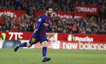 Messi celebrates the equaliser at Sevilla.