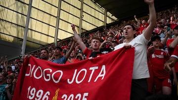 Fans remember Liverpool's late Portuguese striker #20 Diogo Jota following the pre-season friendly football match between Preston North End and Liverpool at Deepdale stadium in Preston, north-west England on July 13, 2025. Liverpool are to retire Diogo Jota's number 20 shirt in honour of the Portugal forward who was killed in a car crash this month. The club return to action for the first time since the July 3 tragedy at English Championship side Preston today. (Photo by Oli SCARFF / AFP) / RESTRICTED TO EDITORIAL USE. No use with unauthorized audio, video, data, fixture lists, club/league logos or 'live' services. Online in-match use limited to 120 images. An additional 40 images may be used in extra time. No video emulation. Social media in-match use limited to 120 images. An additional 40 images may be used in extra time. No use in betting publications, games or single club/league/player publications. /