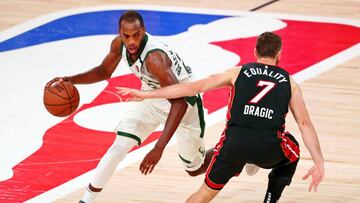 Sep 6, 2020; Lake Buena Vista, Florida, USA; Milwaukee Bucks forward Khris Middleton (22) dribbles against Miami Heat guard Goran Dragic (7) during overtime of game four of the second round of the 2020 NBA Playoffs at ESPN Wide World of Sports Complex. Mandatory Credit: Kim Klement-USA TODAY Sports