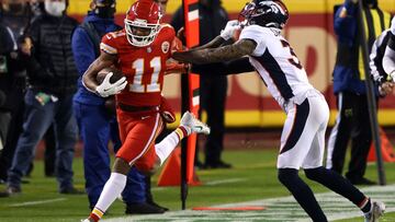 (FILES) In this file photo taken on December 05, 2020 Demarcus Robinson #11 of the Kansas City Chiefs pushes off Justin Simmons #31 of the Denver Broncos during the first quarter of a game at Arrowhead Stadium in Kansas City, Missouri. - The Kansas City C