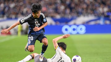 Japan�s midfielder Takefusa Kubo (top L) clashes with China's defender Liu Yang (bottom R) during the third round 2026 World Cup qualifying round football match between Japan and China at Saitama Stadium in Saitama, north of Tokyo, on September 5, 2024. (Photo by Yuichi YAMAZAKI / AFP)