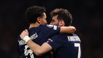 TOPSHOT - Paris Saint-Germain's Brazilian defender #05 Marquinhos (L) celebrates with Paris Saint-Germain's Georgian forward #07 Khvicha Kvaratskhelia (R) after scoring Paris Saint-Germain's first goal during the UEFA Champions League play-off second leg football match between Paris Saint-Germain (PSG) and AS Monaco at the Parc des Princes stadium in Paris on February 25, 2026. (Photo by FRANCK FIFE / AFP)
