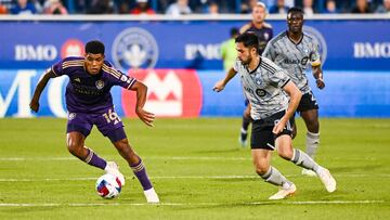 May 6, 2023; Montreal, Quebec, CAN; Orlando City SC midfielder Wilder Cartagena (16) plays the ball against CF Montreal midfielder Mathieu Choiniere (29) during the first half at Stade Saputo. Mandatory Credit: David Kirouac-USA TODAY Sports
