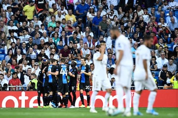 Club Brugge's players celebrate after Nigerian forward Emmanuel Bonaventure scored a second goal during the UEFA Champions league Group A football match between Real Madrid and Club Brugge at the Santiago Bernabeu stadium in Madrid on October 1, 2019.