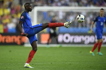 France's midfielder Paul Pogba kicks the ball during the Euro 2016 group A football match between France and Romania at Stade de France