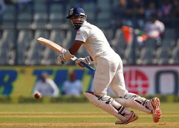 Vijay plays a shot on his way to 136.