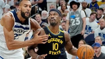 May 6, 2025; Minneapolis, Minnesota, USA; Golden State Warriors forward Jimmy Butler (10) goes to the basket against Minnesota Timberwolves center Rudy Gobert (27) in the fourth quarter during game one of the second round for the 2025 NBA Playoffs at Target Center. Mandatory Credit: Bruce Kluckhohn-Imagn Images