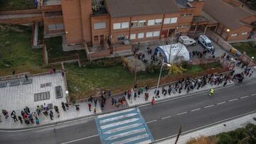 TOLEDO, SPAIN - DECEMBER 15: Children queue with their families to receive their first dose of the Covid-19 vaccine at a walk in clinic at Sculptor Alberto Sanchez Public School on December 15, 2021 in Toledo, Spain.  Spain began the Covid-19 vaccination 