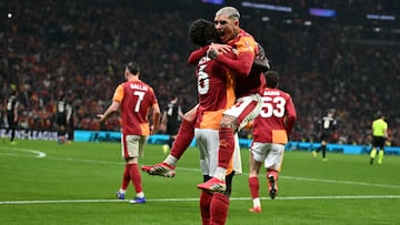 Galatasaray's Colombian defender #06 Davinson Sanchez celebrates with Galatasaray's Uruguayan midfielder #34 Lucas Torreira (R) after scoring his team's third goal during the UEFA Champions League, knockout round play-off 1st leg, football match between Galatasaray SK and Juventus FC at the Rams Park in Istanbul on February 17, 2026. (Photo by OZAN KOSE / AFP)