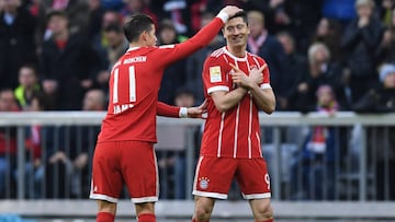 Bayern Munich&#039;s Colombian James Rodriguez (L) and Bayern Munich&#039;s Polish striker Robert Lewandowski (R) celebrate after the first goal for Munich during the German first division Bundesliga football match FC Bayern Munich vs Borussia Dortmund in