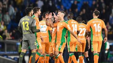 Real Betis' players celebrate victory at the end of the Spanish league football match between Real Sociedad and Real Betis, at the Reale Arena stadium in San Sebastian on October 30, 2022. - Real Betis won 0-2. (Photo by ANDER GILLENEA / AFP) (Photo by ANDER GILLENEA/AFP via Getty Images)