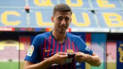 BarcelonaxAB&#039;s new player French defender Clement Lenglet poses with his new jersey during his official presentation at the Camp Nou stadium in Barcelona on July 13, 2018.
 Clement Lenglet will join up with compatriots Samuel Umtiti and Gerard Pique 