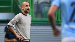 (FILES) This file photo taken on August 15, 2020 shows Manchester City&#039;s Spanish manager Pep Guardiola standing on the sideline during the UEFA Champions League quarter-final football match between Manchester City and Lyon at the Jose Alvalade stadiu