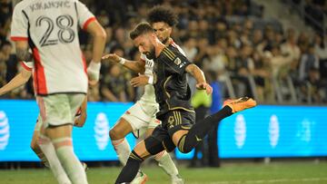 Aug 13, 2024; Los Angeles, California, USA; Los Angeles FC forward Olivier Giroud (9) is defended by San Jose Earthquakes defender Rodrigues (26) in the second half at BMO Stadium. Mandatory Credit: Jayne Kamin-Oncea-USA TODAY Sports