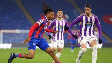 LONDON, ENGLAND - DECEMBER 16: Michael Olise of Crystal Palace holds off pressure from Sergio Escudero of Real Valladolid during the friendly match between Crystal Palace and Real Valladolid at Selhurst Park on December 16, 2022 in London, England. (Photo by Clive Rose/Getty Images)