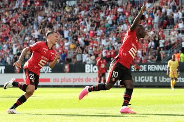 Rennes' Belgian forward #10 Jeremy Doku celebrates scoring his team's third goal during the French L1 football match between Stade Rennais FC and FC Metz at The Roazhon Park Stadium in Rennes, western France, on August 13, 2023. (Photo by LOU BENOIST / AFP)