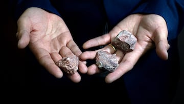 Wenhao Sun, Dow Early Career Professor of Engineering and Assistant Professor of Materials Science and Engineering holds pieces of dolomite rock while standing in his lab. 

Scientists have grown dolomite crystals in a laboratory for the first time.

Dolomite is an abundant mineral in ancient geologic features -- think the Dolomites in Itlay or the capstone of Niagara Falls, but it's absent in modern formations unlike other limestone minerals. Geologists knew that the answer to this riddle must be hidden in the way dolomite forms, but nobody has ever gotten a dolomite crystal to grow in the lab.
Wenhao Sun's lab was able to come up with a model to explain why dolomite crystals can't grow in the lab the way other limestone minerals do: the mineral requires repeated cycles of dissolving and crystalizing to grow. They tested this idea out in the lab and managed to grow dolomite in the lab for the first time.
Wenhao thinks the same principle could apply to other hard to synthesize materials. One promising material for thin solar cells, CZTS, has been hard to make because it is blocked by the same crystal growth problems as dolomite. Maybe dissolving the CZTS between periods of crystal growth is required to make this material?
The corresponding author is Wenhao Sun, Dow Early Career Professor of Engineering and Assistant Professor of Materials Science and Engineering.
The first author is Joonsoo Kim, a doctoral student of materials science and engineering.

October 31, 2023. 

Photo by Marcin Szczepanski/Lead Multimedia Storyteller, Michigan Engineering
