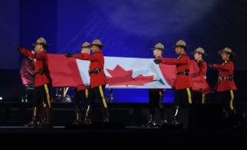 Canadian mounties carry the national flag during the opening ceremony for the 2015 Pan American Games at the Rogers Centre in Toronto, Ontario, on July 10, 2015.    AFP PHOTO / HECTOR RETAMAL