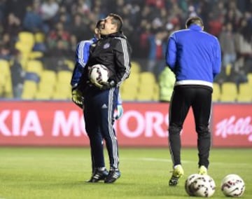 Paraguayan players warm up before the start of the Copa America third place football match against Peru in Concepcion, Chile on July 3, 2015.  AFP PHOTO / JUAN BARRETO