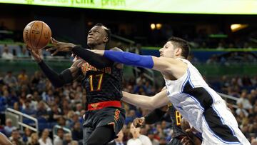 Jan 4, 2017; Orlando, FL, USA; Atlanta Hawks guard Dennis Schroder (17) gets fouled by Orlando Magic center Nikola Vucevic (9) during the second half at Amway Center. Atlanta Hawks defeated the Orlando Magic 111-92. Mandatory Credit: Kim Klement-USA TODAY Sports