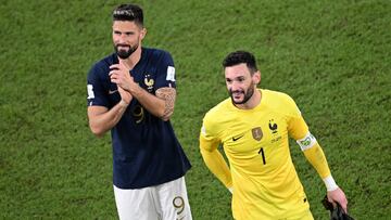 (FILES) France's forward #09 Olivier Giroud and France's goalkeeper #01 Hugo Lloris applaud the fans the Qatar 2022 World Cup Group D football match between France and Denmark at Stadium 974 in Doha on November 26, 2022. France's record goal scorer Olivier Giroud has reached agreement with Los Angeles FC to join the Major League Soccer club this summer, sources close to the player confirmed on April 23, 2024. The 37-year-old, whose contract with Italian club AC Milan expires at the end of the season, has committed to an 18-month deal with the Californian club starting on August 1, according to reports in France. LAFC will be the eighth club that 2018 World Cup winner Giroud has played for over two decades. (Photo by Anne-Christine POUJOULAT / AFP)