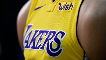 (FILES) Lonzo Ball #2 of the Los Angeles Lakers wears his new Nike jersey with the sponsor's logo "Wish" on the left chests during media day September 25, 2017, in El Segundo, California. The Los Angeles Lakers are being sold in a record-breaking $10 billion deal that makes the iconic franchise the highest-valued sports team in US history, ESPN reported on June 18, 2025. (Photo by KEVORK DJANSEZIAN / GETTY IMAGES NORTH AMERICA / AFP)