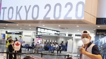 France's Florian Thauvin (R) arrives with other members of the French football team for the Tokyo 2020 Olympic Games at Narita International Airport in Narita, Chiba prefecture on July 17, 2021. (Photo by Charly TRIBALLEAU / AFP)