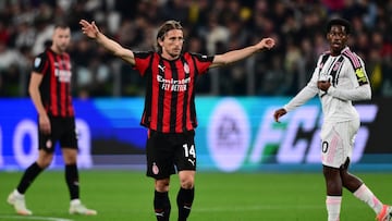 AC Milan's Croatian midfielder #14 Luka Modric reacts during the Italian Serie A football match between Juventus and AC Milan at The Allianz Stadium in Turin on October 5, 2025. (Photo by MARCO BERTORELLO / AFP)