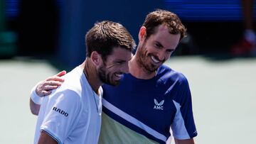 MASON, OHIO - AUGUST 17: Cameron Norrie of Great Britain embraces Andy Murray of Great Britain after beating him in the second round  of the men's singles at the Lindner Family Tennis Center on August 17, 2022 in Mason, Ohio. (Photo by Frey/TPN/Getty Images)