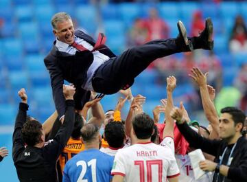 Carlos Queiroz tossed in the air after Iran secure victory in Saint Petersburg.