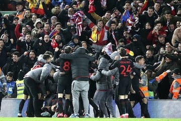 Atlético Madrid players celebrate with their fans after scoring in extra time 2-3 during the UEFA Champions League game against Liverpool.