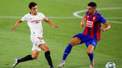 SEVILLE, SPAIN - JULY 06: Jesus Navas of Sevilla FC competes for the ball with Sergio Alvarez of SD Eibar during the Liga match between Sevilla FC and SD Eibar SAD at Estadio Ramon Sanchez Pizjuan on July 06, 2020 in Seville, Spain. Football Stadiums arou