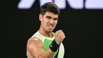 Spain's Carlos Alcaraz celebrates after victory against Australia's Adam Walton during their men's singles match on day one of the Australian Open tennis tournament in Melbourne on January 18, 2026. (Photo by Paul Crock / AFP) / -- IMAGE RESTRICTED TO EDITORIAL USE - STRICTLY NO COMMERCIAL USE --