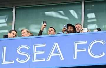 John Terry (centre) watches Chelsea's league game against Newcastle United at Stamford Bridge, 13 March 2022.