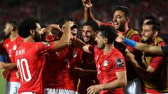 Egypt&#039;s midfielder Mahmoud &#039;Trezeguet&#039; Hassan (2nd-L) celebrates with his teammates after scoring a goal during the 2019 Africa Cup of Nations (CAN) football match between Egypt and Zimbabwe at Cairo International Stadium on June 21, 2019. 