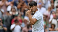 Spain's Carlos Alcaraz celebrates winning against Estonia's Mark Lajal during their men's singles tennis match on the first day of the 2024 Wimbledon Championships at The All England Lawn Tennis and Croquet Club in Wimbledon, southwest London, on July 1, 2024. Alcaraz won the match 7-6, 7-5, 6-2. (Photo by Glyn KIRK / AFP) / RESTRICTED TO EDITORIAL USE